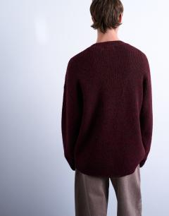 Model wearing Oversized fit crew jumper in burgundy