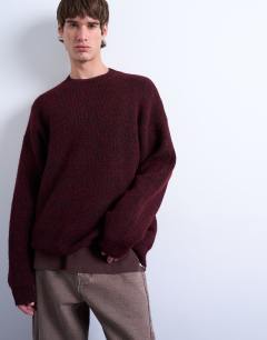 Model wearing Oversized fit crew jumper in burgundy