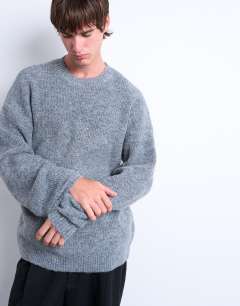 Model wearing Oversized fit crew jumper in charcoal