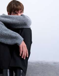 Model wearing Oversized fit crew jumper in charcoal