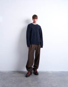 Model wearing Oversized fit crew jumper in navy