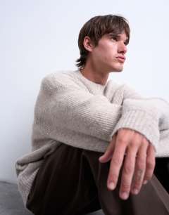 Model wearing Oversized fit crew jumper in stone