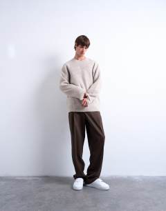 Model wearing Oversized fit crew jumper in stone