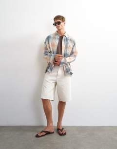 Model wearing Oversized fit crinkle check shirt in grey