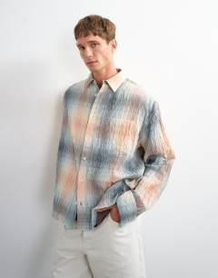 Model wearing Oversized fit crinkle check shirt in grey