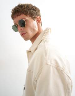 Model wearing Oversized fit denim jacket in natural