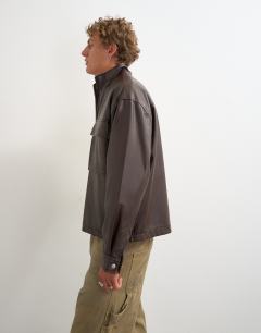 Model wearing Oversized fit faux leather 1/4 zip funnel neck jacket in brown