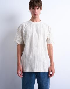Model wearing Oversized fit fine stripe t-shirt in ecru