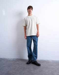 Model wearing Oversized fit fine stripe t-shirt in ecru