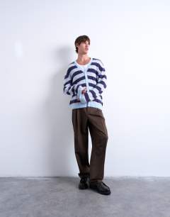 Model wearing Oversized fit fluffy knitted stripe cardigan in blue