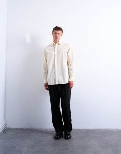 Model wearing Oversized fit formal shirt in light yellow