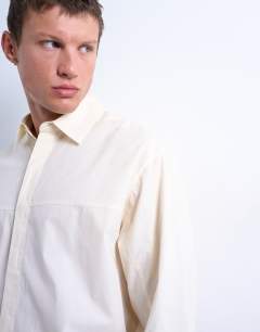 Model wearing Oversized fit formal shirt in light yellow