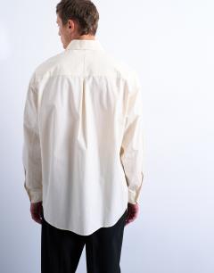 Model wearing Oversized fit formal shirt in light yellow