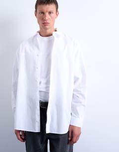 Model wearing Oversized fit formal shirt in white