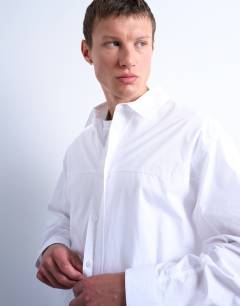 Model wearing Oversized fit formal shirt in white