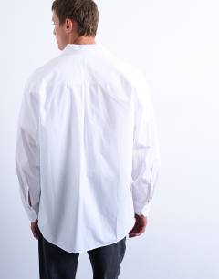 Model wearing Oversized fit formal shirt in white