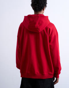 Model wearing Oversized fit heavyweight loopback hoodie in red