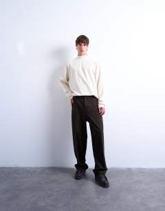 Model wearing Oversized fit high neck long sleeve t-shirt in ecru