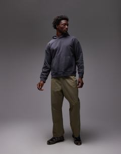 Model wearing Oversized fit hoodie in washed black