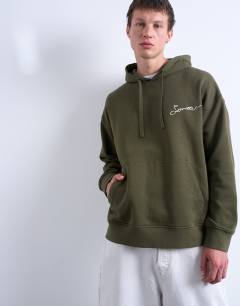 Model wearing Oversized fit hoodie with sorrow embroidery in khaki