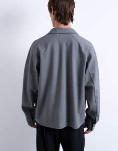 Model wearing Oversized fit interlock jersey jacket in grey