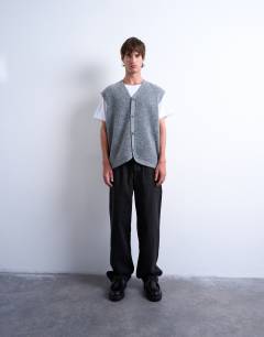 Model wearing Oversized fit knitted button through tank in charcoal