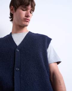 Model wearing Oversized fit knitted button through tank in navy