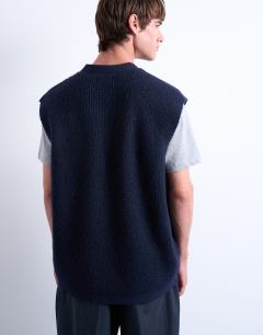 Model wearing Oversized fit knitted button through tank in navy