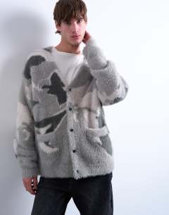 Model wearing Oversized fit knitted cardigan with camo design in grey