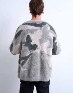 Model wearing Oversized fit knitted cardigan with camo design in grey