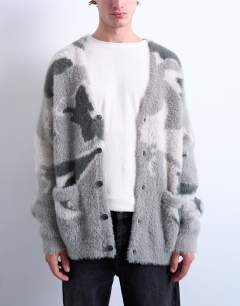 Model wearing Oversized fit knitted cardigan with camo design in grey