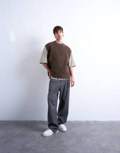 Model wearing Oversized fit knitted crew neck tank in brown