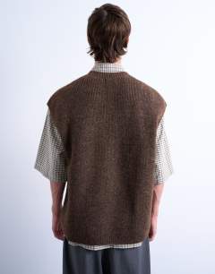 Model wearing Oversized fit knitted crew neck tank in brown