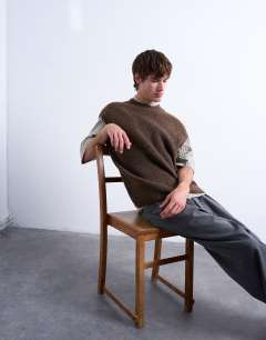 Model wearing Oversized fit knitted crew neck tank in brown