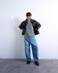 Model wearing Oversized fit knitted crew neck tank in charcoal