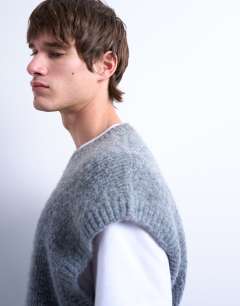 Model wearing Oversized fit knitted crew neck tank in charcoal