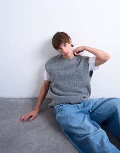 Model wearing Oversized fit knitted crew neck tank in charcoal