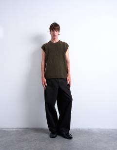 Model wearing Oversized fit knitted crew neck tank in khaki