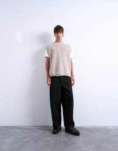 Model wearing Oversized fit knitted crew neck tank in stone