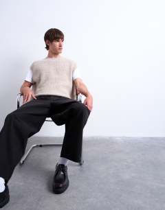 Model wearing Oversized fit knitted crew neck tank in stone