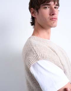 Model wearing Oversized fit knitted crew neck tank in stone