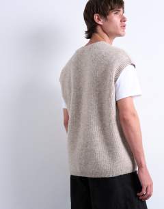 Model wearing Oversized fit knitted crew neck tank in stone