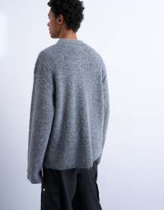 Model wearing Oversized fit knitted polo in charcoal