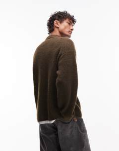 Model wearing Oversized fit knitted polo in khaki