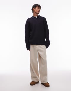 Model wearing Oversized fit knitted polo in navy