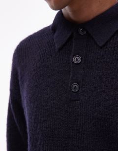 Model wearing Oversized fit knitted polo in navy
