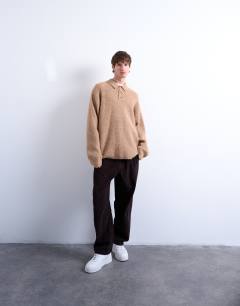 Model wearing Oversized fit knitted polo in stone