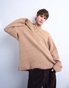 Model wearing Oversized fit knitted polo in stone