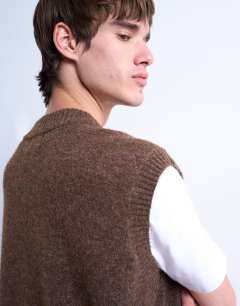 Model wearing Oversized fit knitted v-neck tank in brown