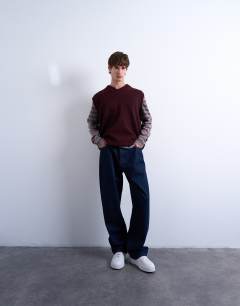 Model wearing Oversized fit knitted v-neck tank in burgundy
